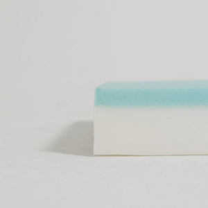 Dual-layer orthopaedic foam with blue cooling gel on a white supportive base